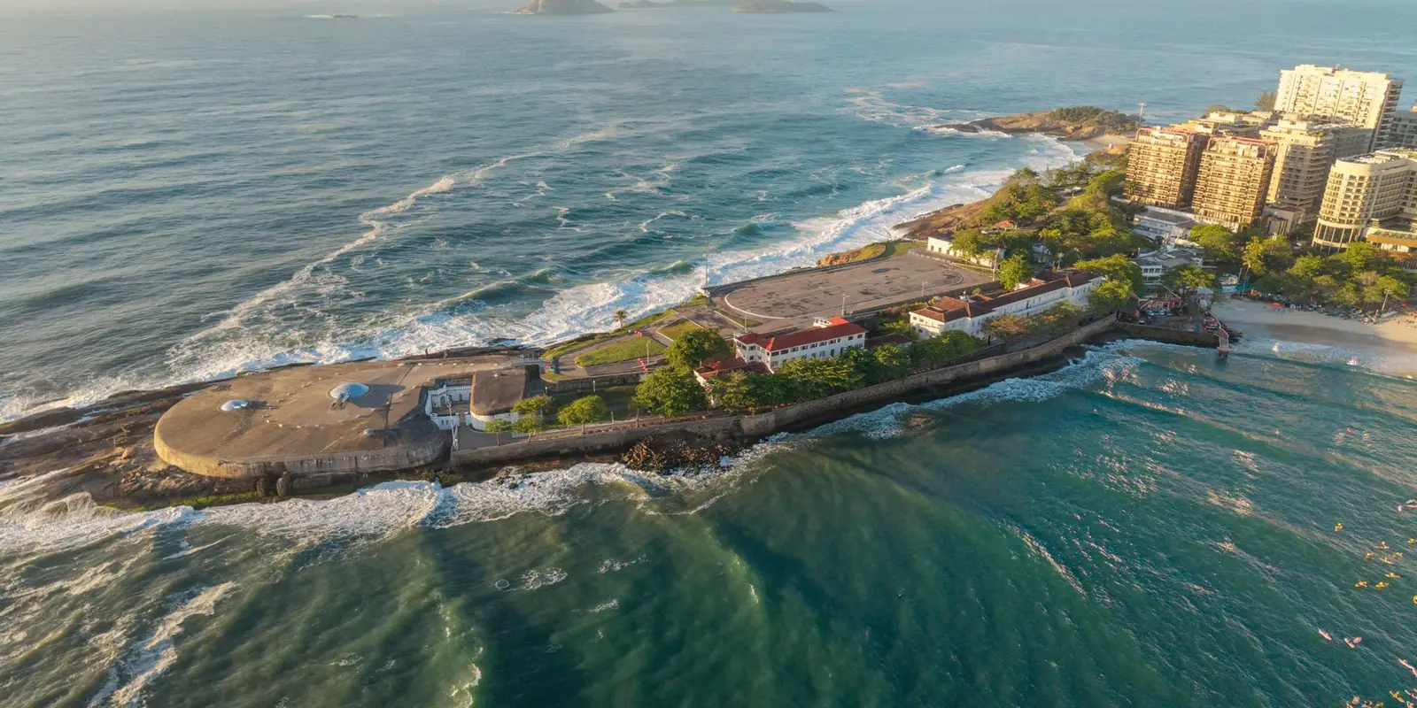 A stunning aerial view of Fort Copacabana island surrounded by the sea in Rio de Janeiro, Brazil.
