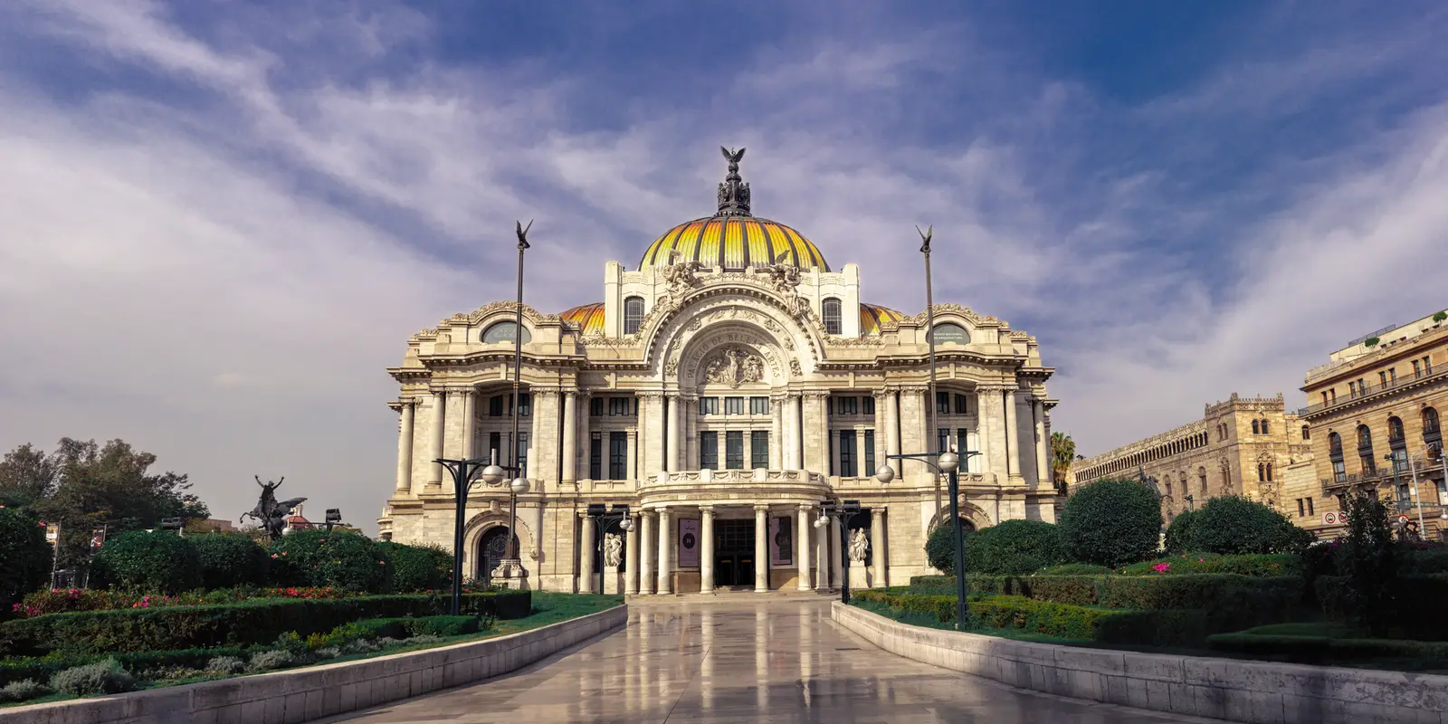 Stunning view of the Palacio de Bellas Artes in Mexico City under a blue sky.