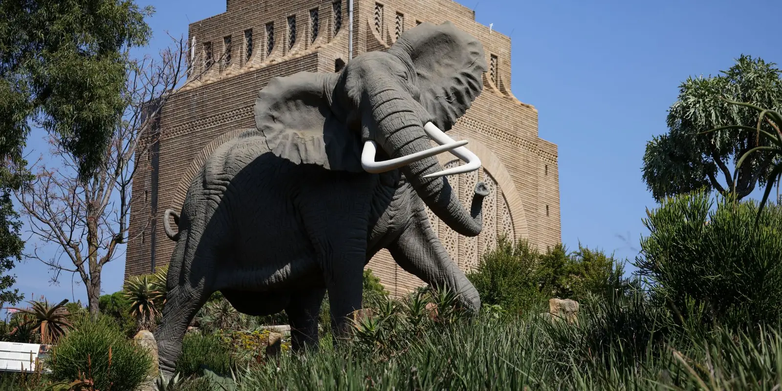 Majestic African elephant statue in front of the Voortrekker Monument in Pretoria, South Africa.