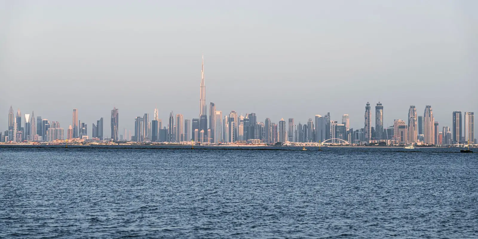 A stunning view of Dubai's skyline featuring Burj Khalifa across the sea.